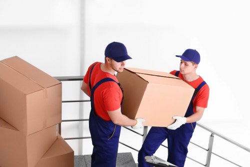 Removal van service operating in Canary Wharf with city buildings in the background