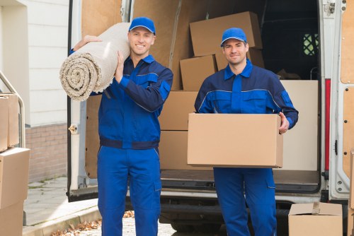 Moving truck service operating in Canary Wharf with modern buildings in the background