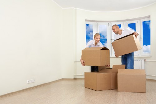 Professional movers packing household items for a Canary Wharf relocation