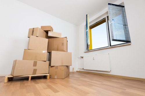 Efficient office relocation setup in Canary Wharf with labelled boxes and workspace planning