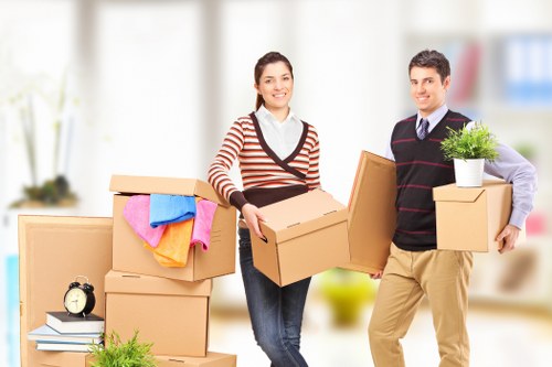 Senior staff assessing a service issue for a man with a van job