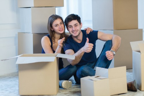 Professional movers transporting office equipment in Canary Wharf