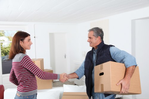 Trained staff handling furniture carefully in a Canary Wharf move