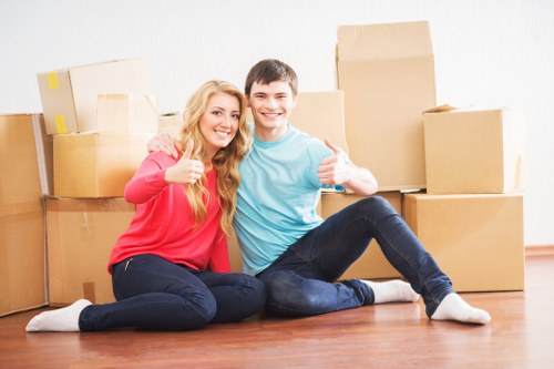 Movers carrying furniture during a house move in Canary Wharf