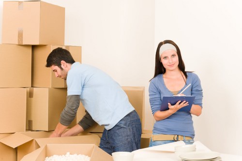 Prepared moving truck with boxes and furniture ready for transport in Canary Wharf