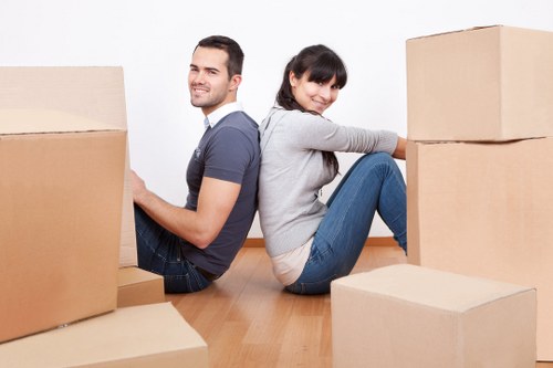 Professional office movers handling desks and equipment in Canary Wharf