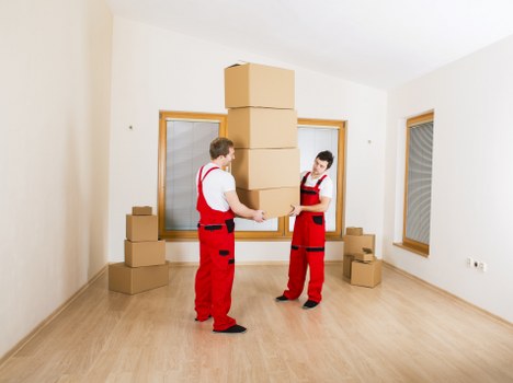 Packing boxes for home moves in Canarywharf with careful organization