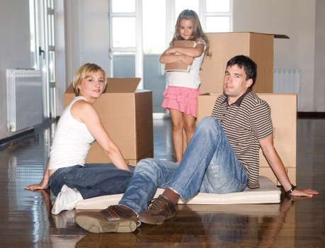 Professional movers assisting with a high-rise flat move near Canary Wharf