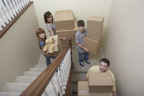 Removal team handling furniture during a Canary Wharf apartment move